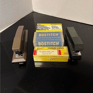 Two staplers with boxes of staples